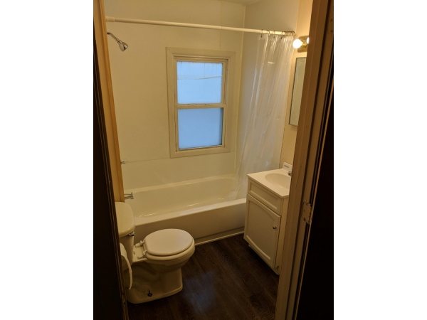 One bathroom with tub and shower